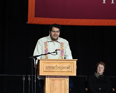 Brett Hernandez-Marin '25 speaks from the podium